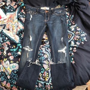 Dark wash destroyed super skinny jeans